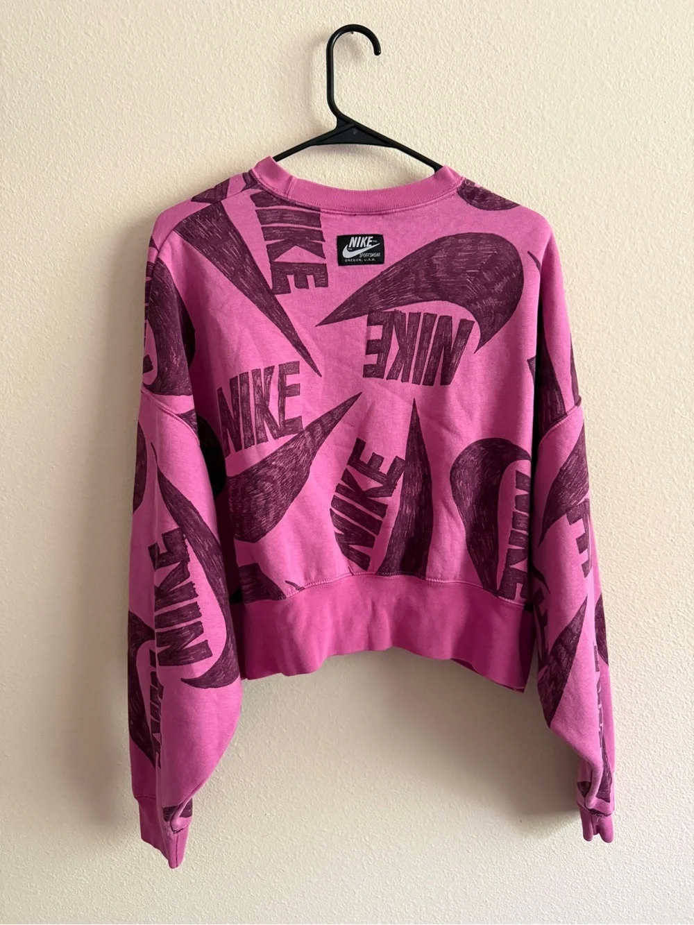 Nike Cropped Logo Sweatshirt in Bright Pink with Dark Maroon Print